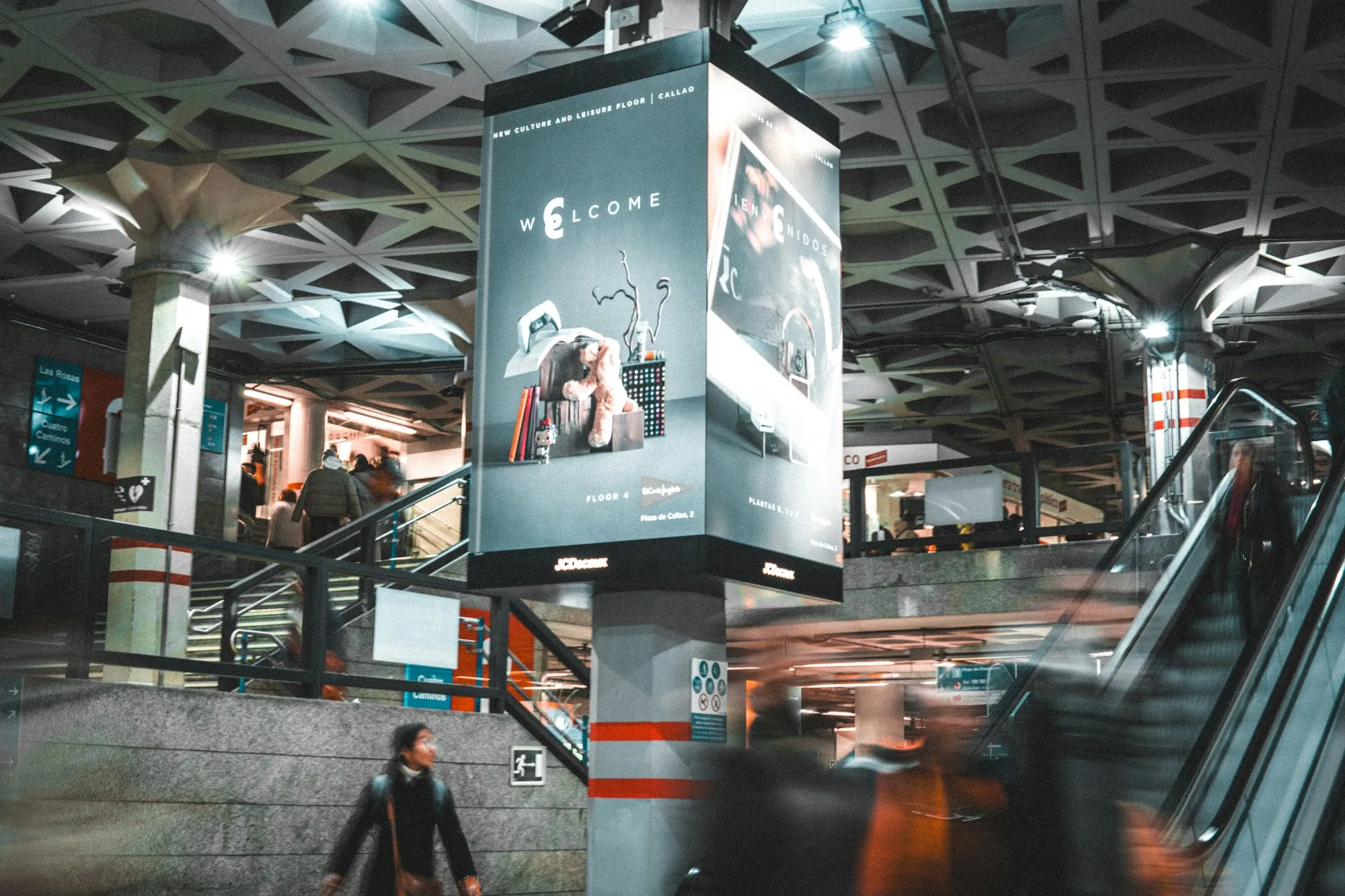 A digital advertising display running inside a metro station