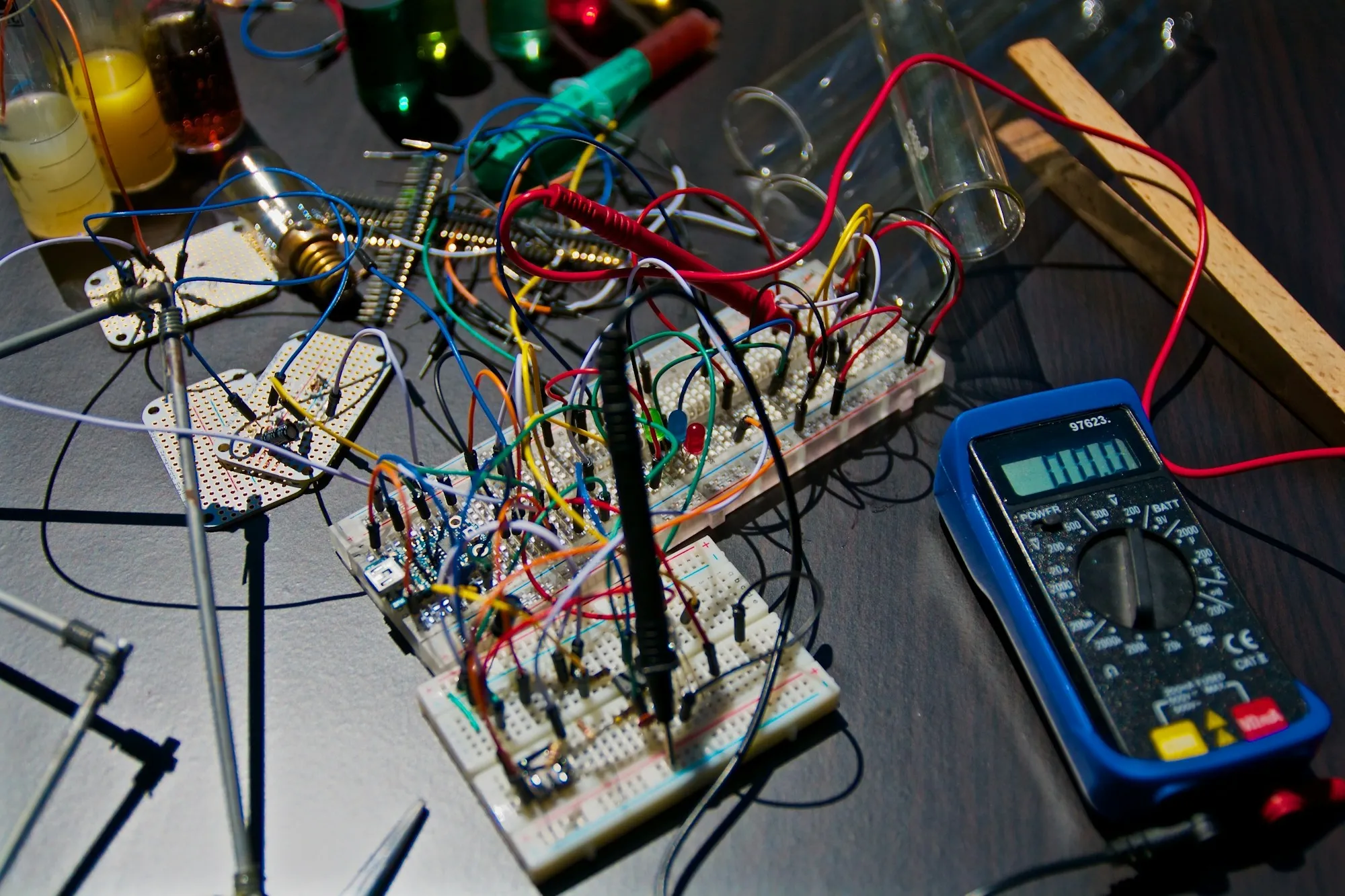 Electronic control boards arranged next to a bench tester